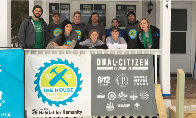 Avionté employees posing at a Habitat for Humanity "The House that Beer Built" build