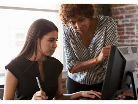 Two women at computer using staffing platform